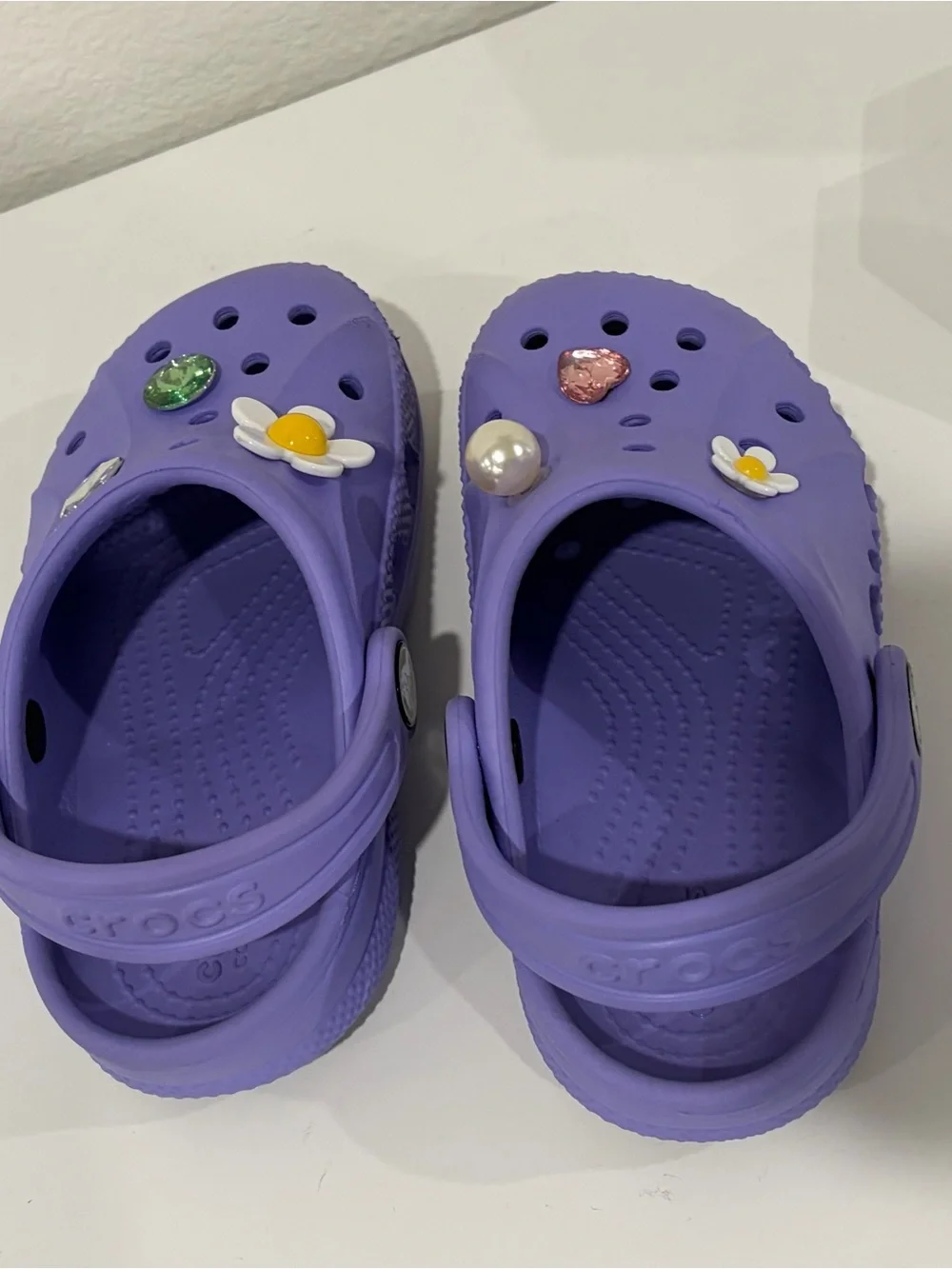 Girls size 9 toddler. Purple CROCS  Great Condition! Charms included